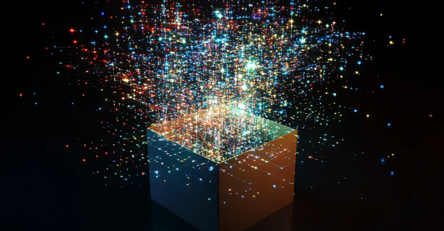 Cube emitting colorful data points, with blue, red, and gold light particles streaming upward against a black background, representing data transformation and AI capabilities.